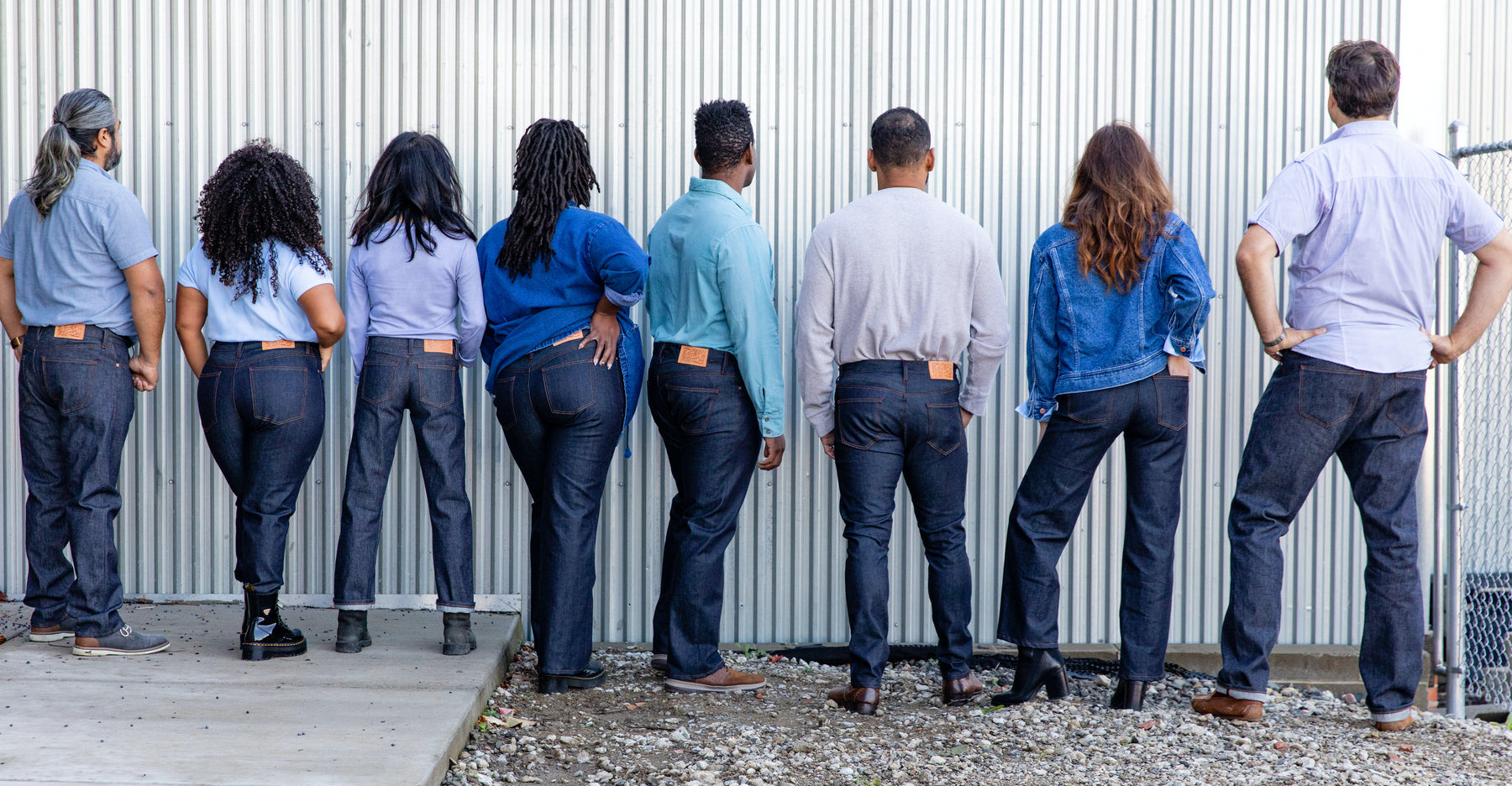a group wearing detroit denim sustainable custom jeans and showing the backs